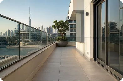 Tiled residential terrace with a glass balustrade