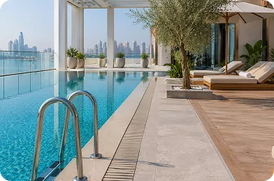 Rooftop swimming pool surrounded by stone decking