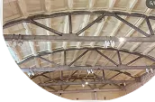 Insulated underside of a warehouse metal roof structure