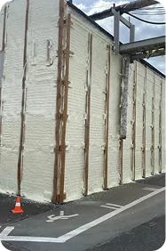 Sprayed foam insulation on a facade